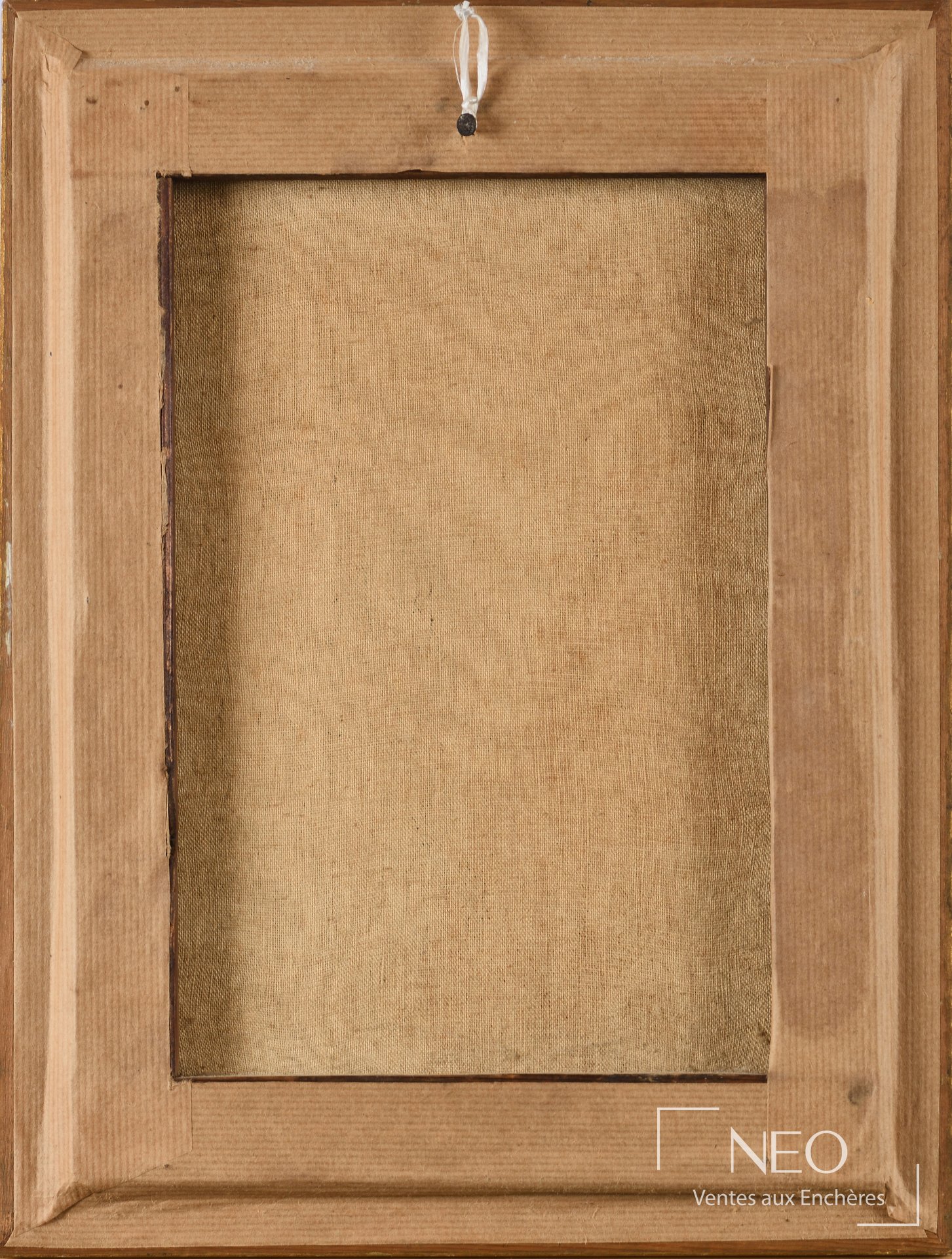 Dos du tableau montrant le châssis en bois et la toile tendue